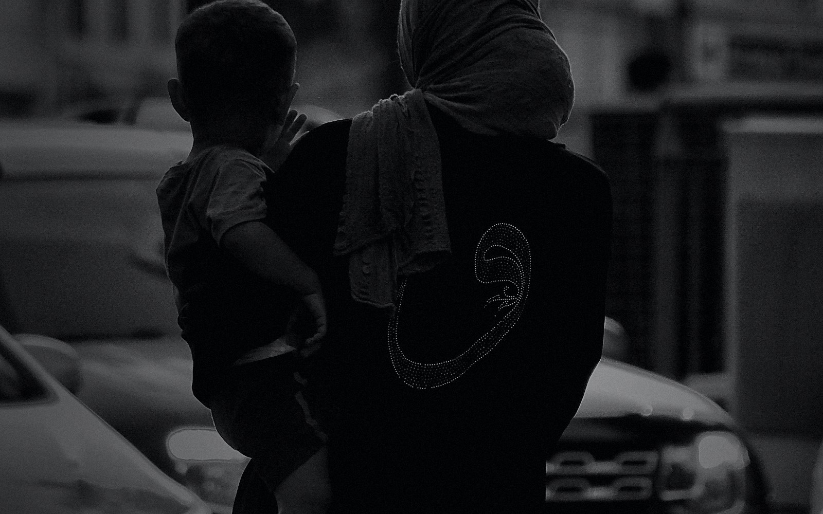 Mother and child in a cinematic black and white public safety scene
